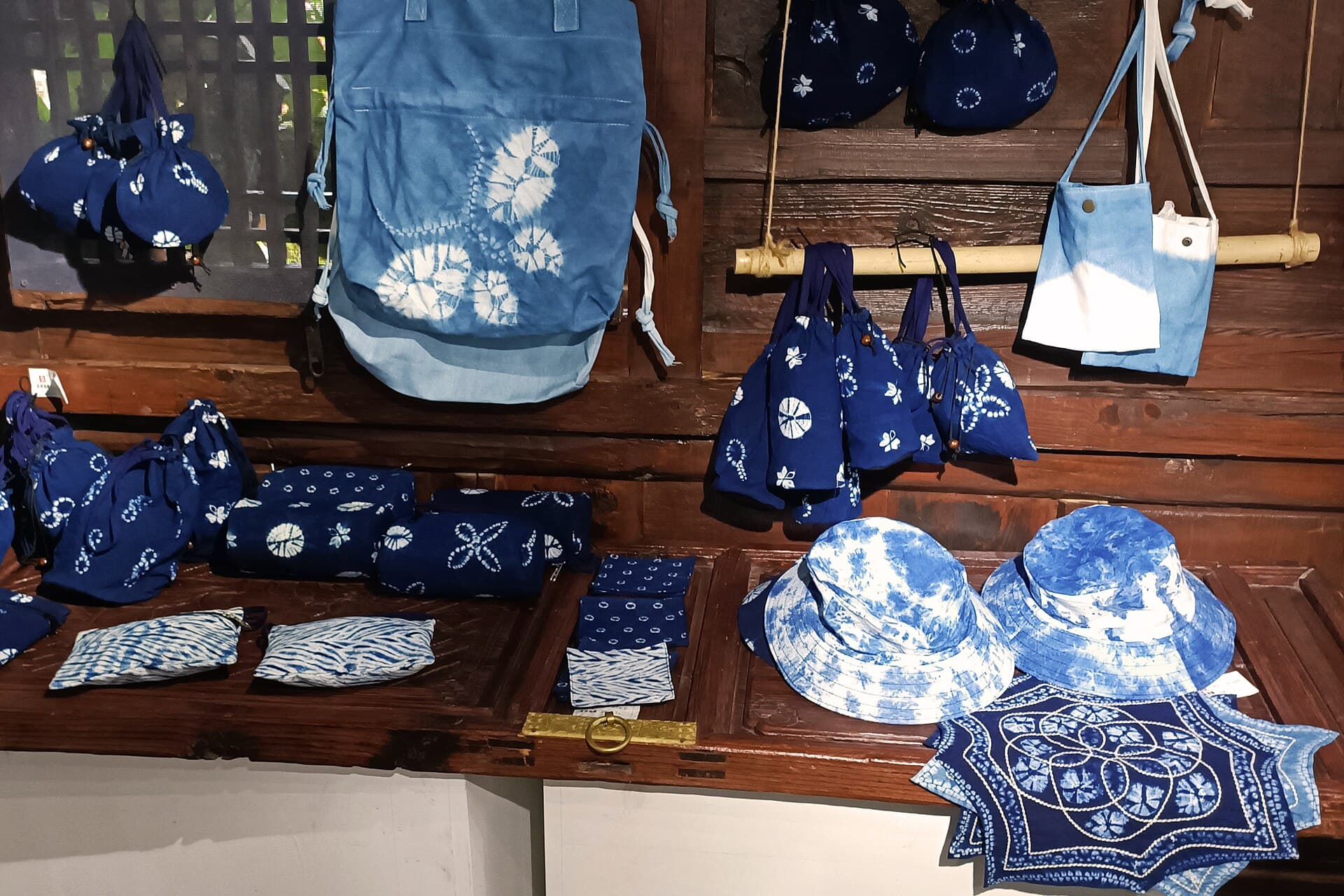 Finished Dali blue and white tie-dye bags, hats, and textile goods